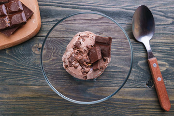 Chocolate sundae ice cream in glass bowl, flat lay. Summer seasonal sweets, cold refreshing dessert