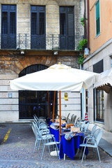  Verona, Italy. The empty tables of cafe in the background
