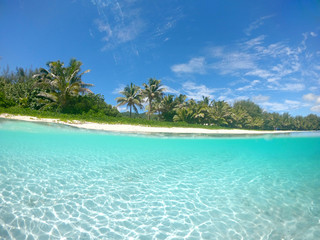 HALF UNDERWATER: Cool shot of empty tropical beach in the tourist off season