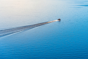 Cruise boat in the blue calm sea - sea landscape