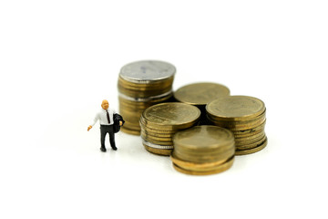 Miniature people : leader and business owner,boss with stack of coins ,Successful team leader concept.