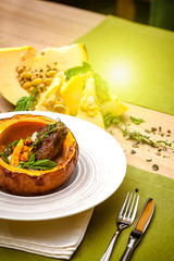 beautiful flow in the restaurant, baked pumpkin with beans and meat, beautiful food closeup