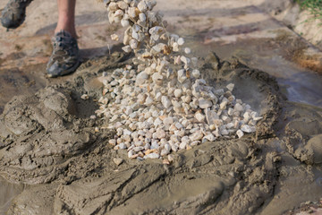 mixing concrete with gravel on construction cite