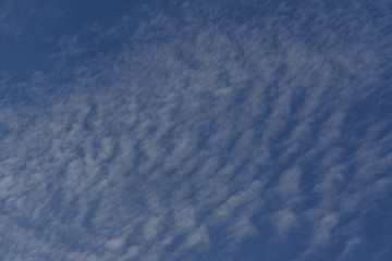blye sky with white fluffy clouds background