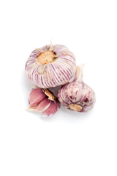Young pink garlic on a clean white background close-up..