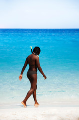 Tourist in Bikini Similan island white sand beach and vibrant turqouise blue Andaman sea. Phang Nga - Phuket, Thailand