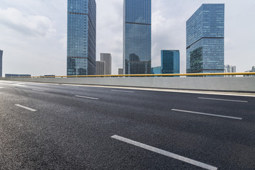 Modern business office buildings with empty road,empty concrete square floor