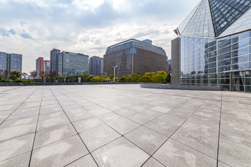 Modern business office buildings with empty road,empty concrete square floor