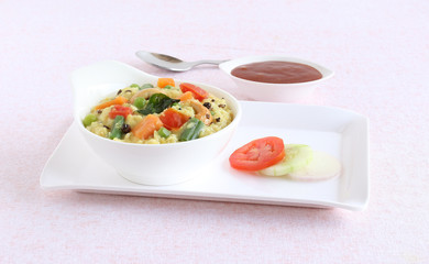 Oats pongal, an healthy, Indian vegetarian food, which is said to prevent or control cholesterol and give other health benefits, with salad and ketchup.