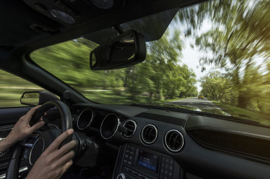 Driver riding fast on street