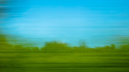 Fototapeta na wymiar Nature in motion from the train window