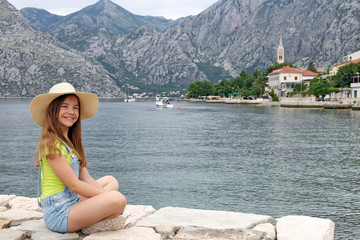 Fototapeta na wymiar happy teenage girl enjoys a summer holiday Kotor bay Montenegro