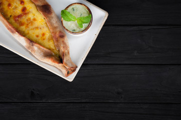 The boat pie with cheese and spinach