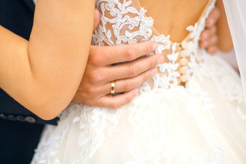 The bride and groom wear wedding rings to each other, simultaneously