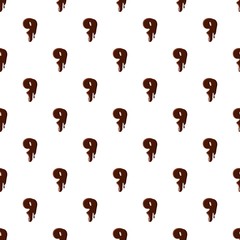 Number 9 from latin alphabet with numbers and symbols made of dark melted chocolate