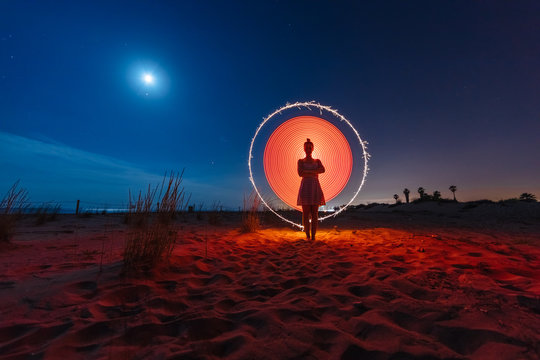 Silhouette of woman with colored lights