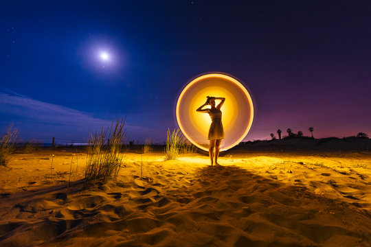 Silhouette of woman with colored lights