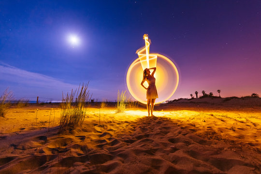 Silhouette of woman with colored lights