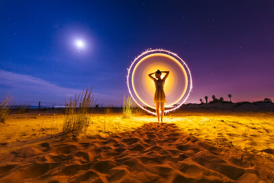 Silhouette of woman with colored lights