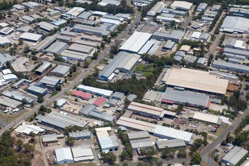 Rolgordijnen zonder boren Industrieel gebouw Light Industrial Area - Newcastle Australia. This aerial view is typical of light industrial and commercial areas in Australia