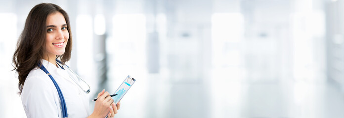 Young female doctor on modern clinic background.