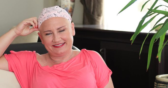 Portrait of a smiling woman with cancer. Breast cancer survivor