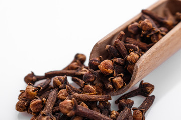 fragrant cloves on a white acrylic background