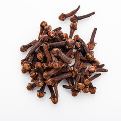 fragrant cloves on a white acrylic background