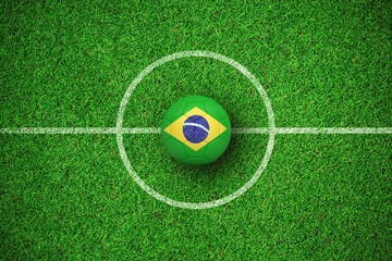 Composite image of football in brasil colours