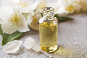 Oil of jasmine. Aromatherapy with jasmine oil. Jasmine flowers