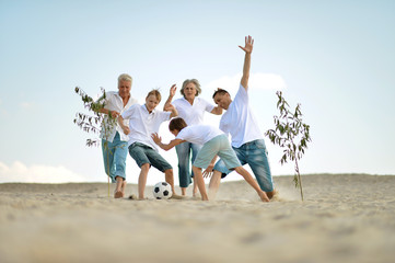 Fototapeta na wymiar Family playing football