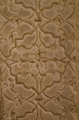 Fototapeta na wymiar Carved stone decoration, art detail, closeup