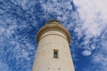 Fototapeta na wymiar Lighthouse Pointing At The Sky 