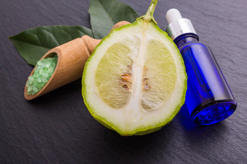 Lemon essential oil on a white background