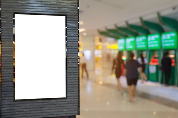 blank showcase billboard or advertising light box for your text message or media content with blurred view of people queuing to withdraw money from ATM, commercial, marketing and financial concept