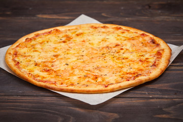 pizza on the wooden background