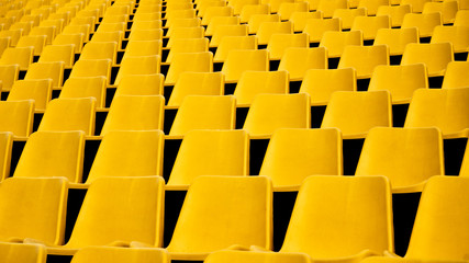 Stadium with yellow seats of the line geometry