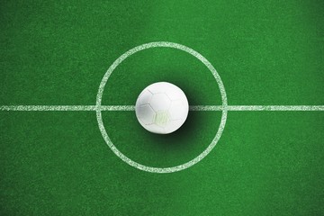 Composite image of white leather football with grass stains