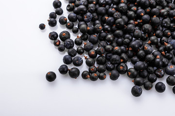 dried juniper berries on a white background