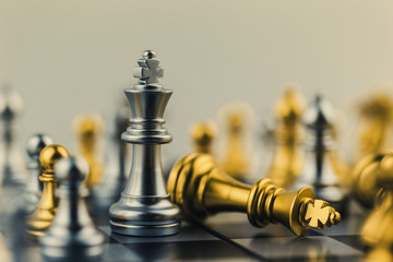 The King in battle chess game stand on chessboard Concept for company strategy,business victory or...