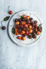 Sweet cherry on the grunge white cutting board background. Rustic style
