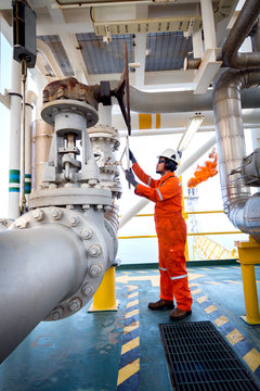 Offshore Oil And Gas Operations, Production Operator Open Manual Operated Valve For Control Gas Flow Rate In Process Gas Platform