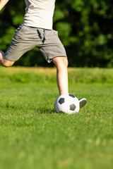 Obraz premium Pre-teen caucasian boy playing outside