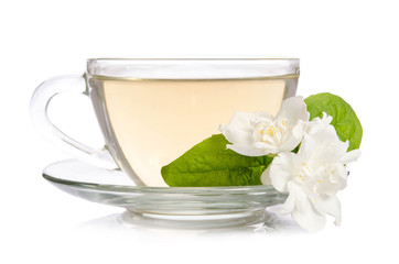 Glass cup of Tea with jasmine flowers isolated on white background
