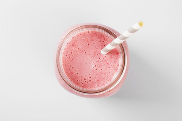 Strawberry smoothies on a pink background