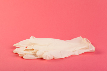 pink rubber gloves  on pink background