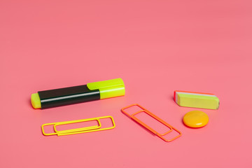 Office clips on bright pink background