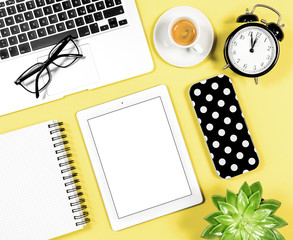 Flat lay office workplace Laptop notebook tablet coffee yellow background