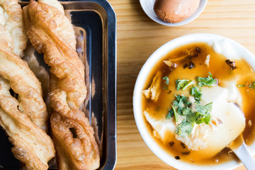 Top view of Chinese breakfast. Chinese deep fried dough and Jellied bean curd.