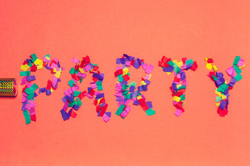 festive party decor and confetti on colored background